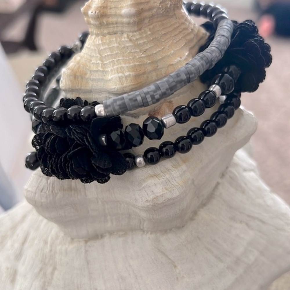 Gray and Black Spiral Bracelet With Floral Embellishment